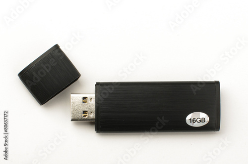 Vászonkép Black aluminium flash drive open cover isolated