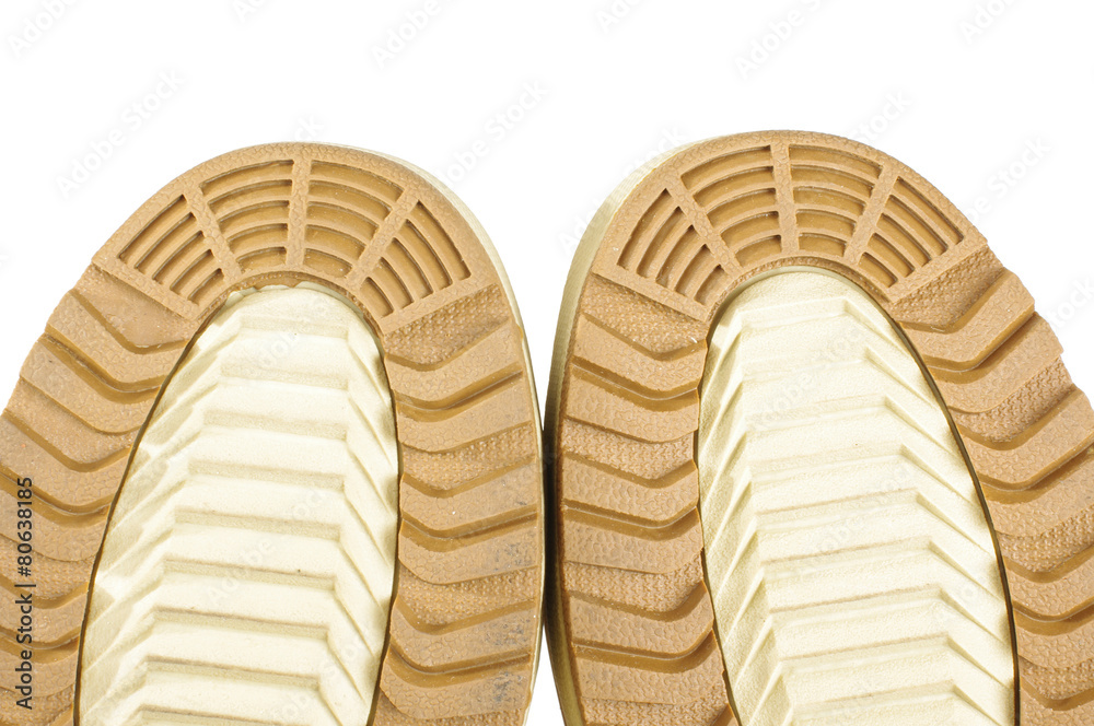 Brown safety shoes sole thread close up 