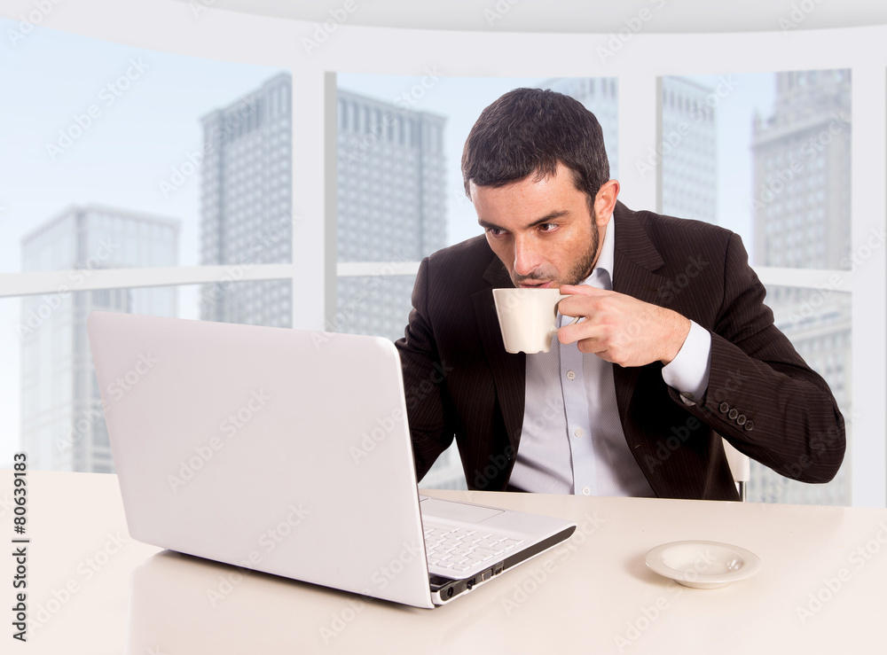 businessman working at office computer drinking coffee businessman working at office computer drinking coffee