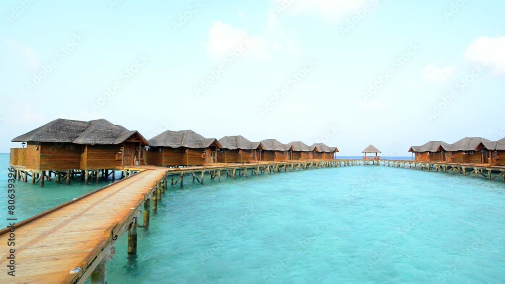Over water bungalows with steps into amazing green lagoon Over water bungalows with steps into amazing green lagoon