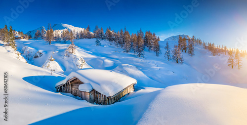 Winter landscape in the Alps at sunset with old mountain cottage #80642105