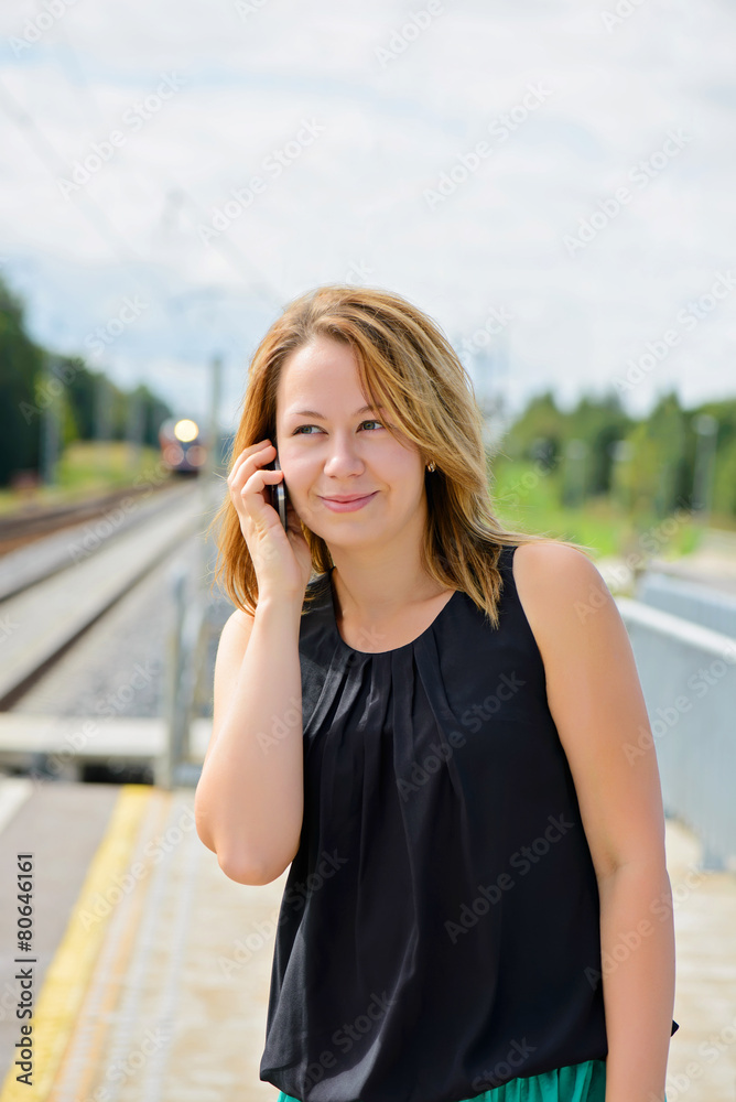 Young beautiful female talking on mobile phone Young beautiful female talking on mobile phone