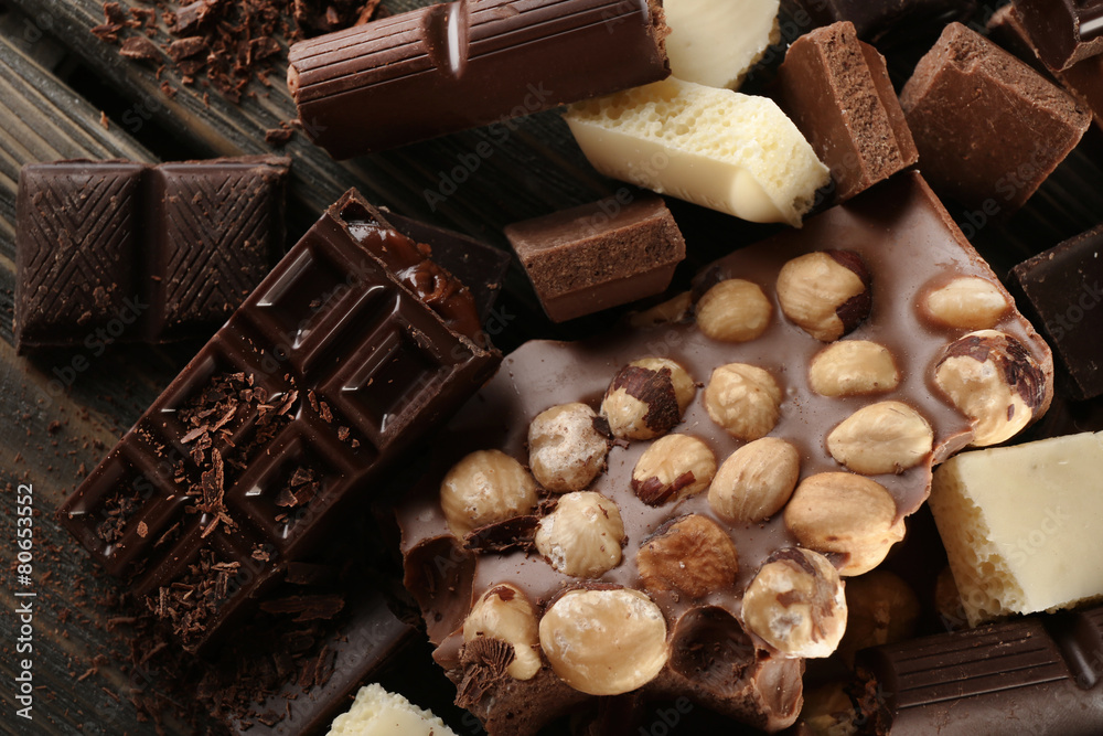 Set of chocolate with hazelnut on wooden table, closeup Set of chocolate with hazelnut on wooden table, closeup