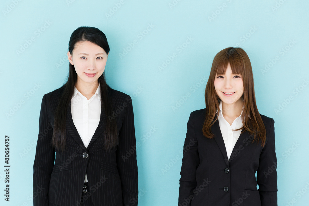 asian businesswomen on blue background