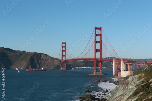 Cargo ship passing Golden Gate bridge