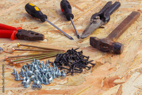 Construction tools: pliers, hammer, shears, screwdriver, pliers photo