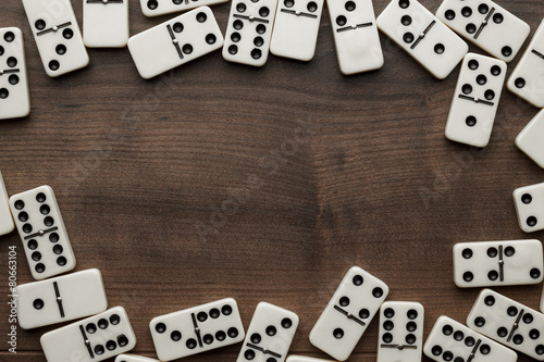 domino pieces on the wooden table background photo