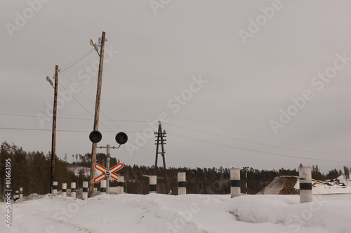 Obraz na plátně Railway level crossing with warning sign