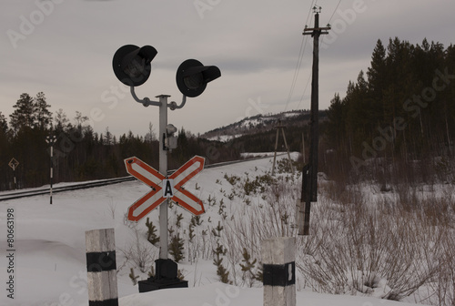 Obraz na plátně Railway level crossing with warning sign