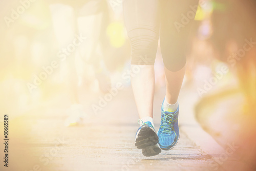 Woman legs and feet closup in warm light