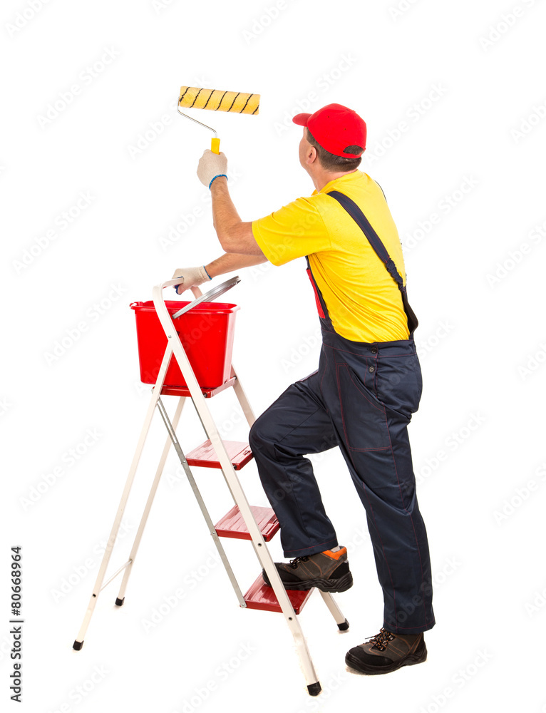 Worker with roller and bucket. Worker with roller and bucket.