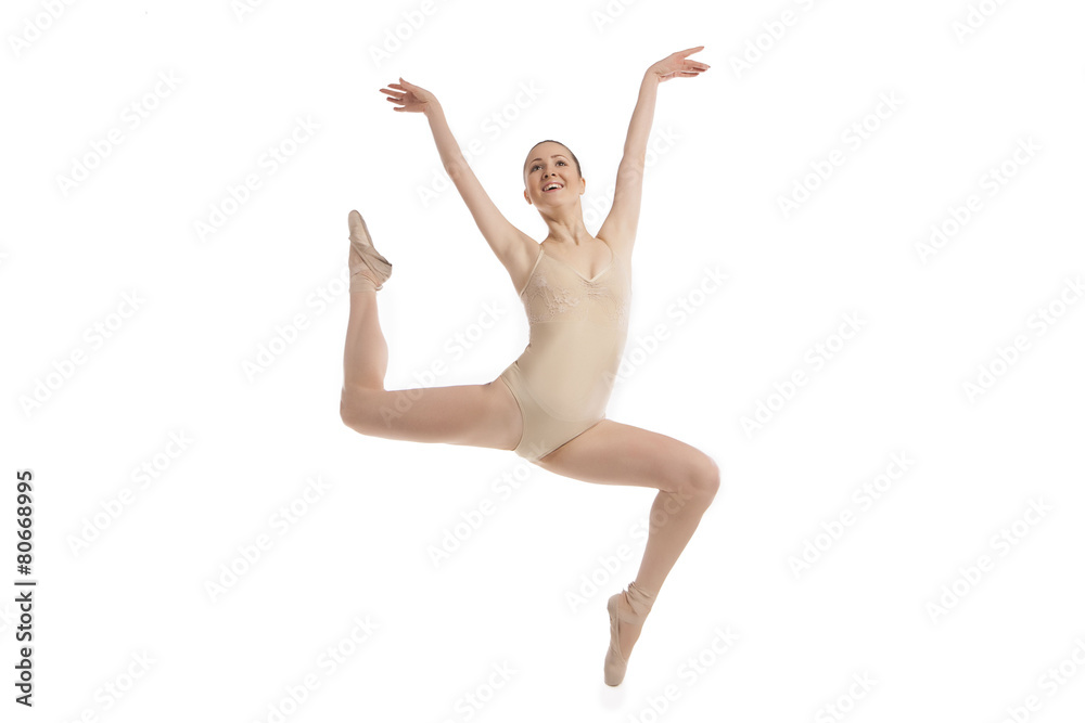 young modern ballet dancer jumping on white background