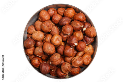 hazelnuts in metal bowl isolated