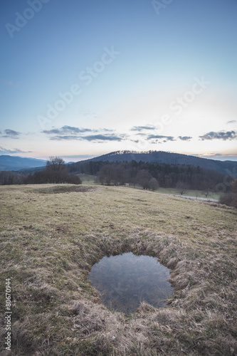 puddle on field during sunset near Freiburg photo