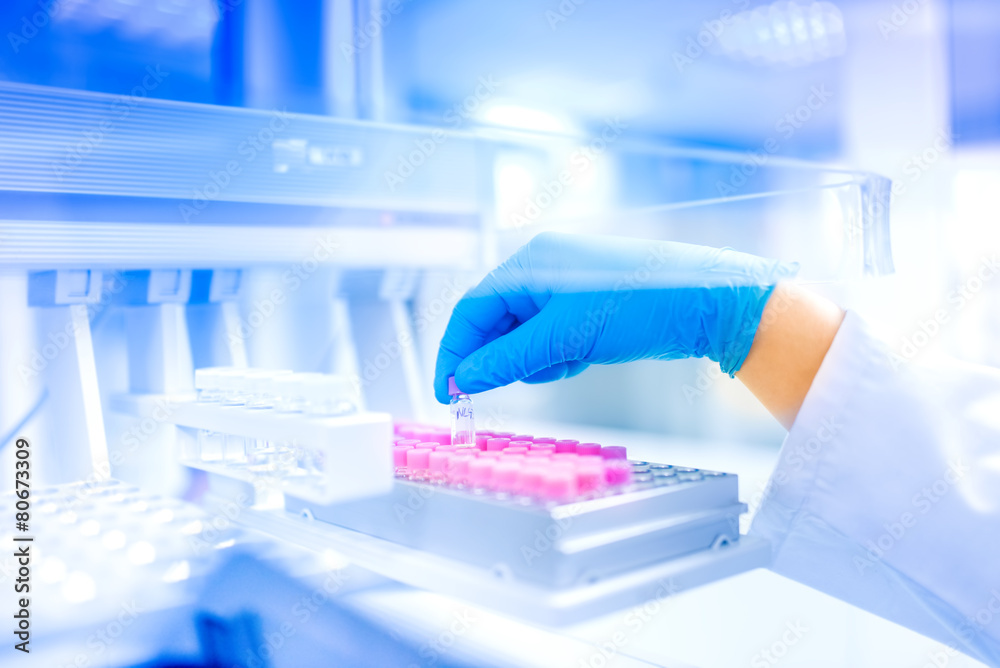 Scientist holding sample in laboratory, hospital details