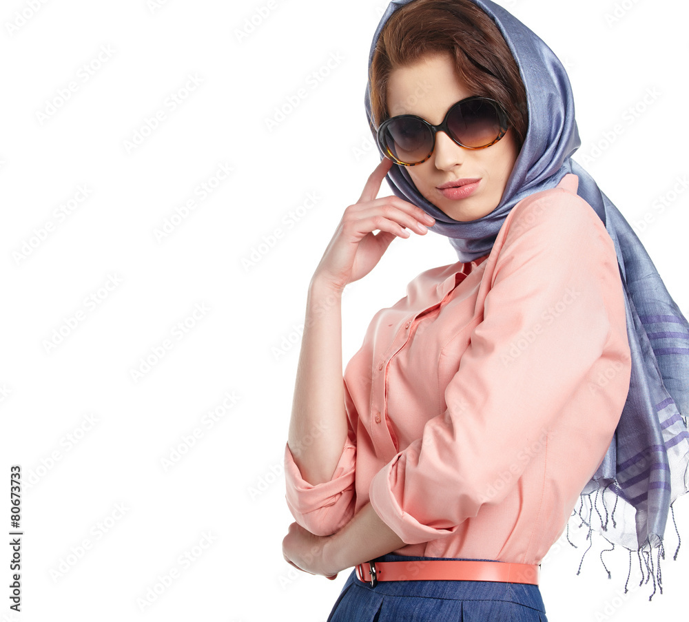 Fashion woman in sunglasses and scarf. studio shot