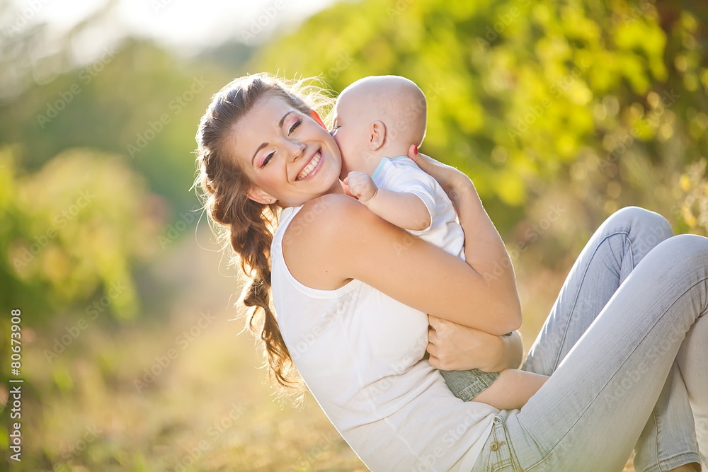 Happy mother with her baby in nature Happy mother with her baby in nature