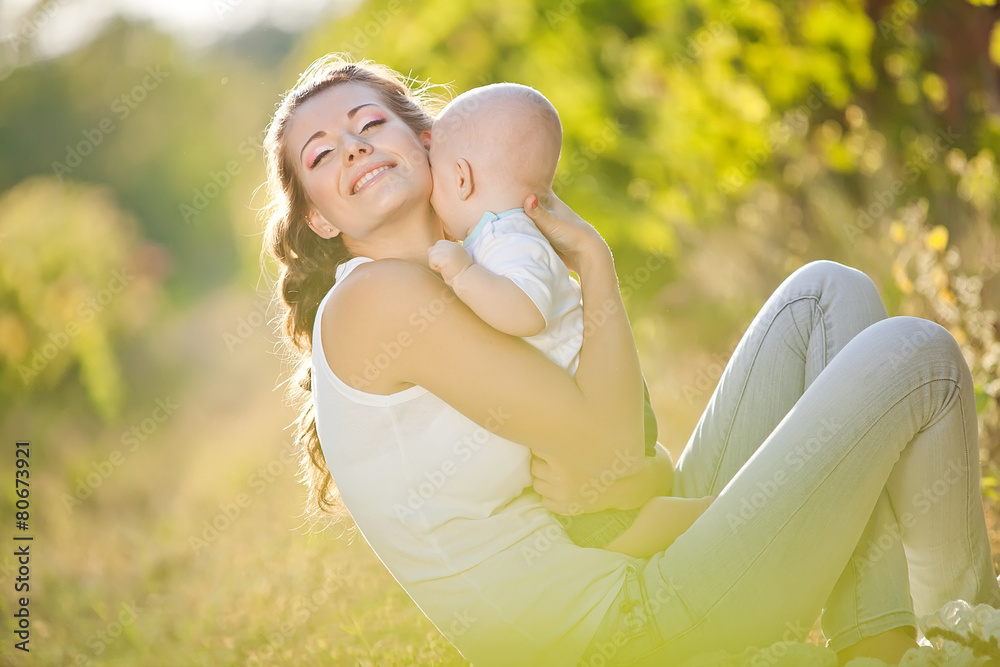 Happy mother with her baby in nature Happy mother with her baby in nature