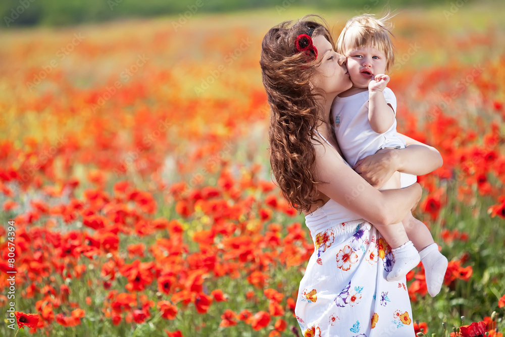 Mother with her son in the flowers field Mother with her son in the flowers field