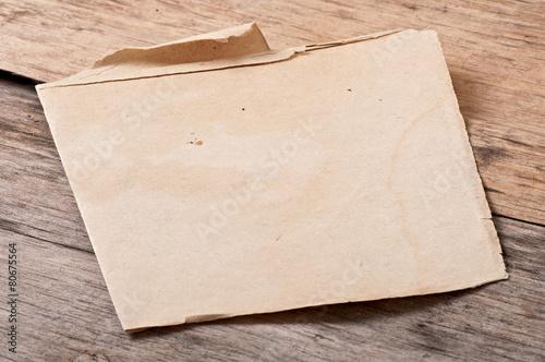 old paper, the price tag on the background of wood