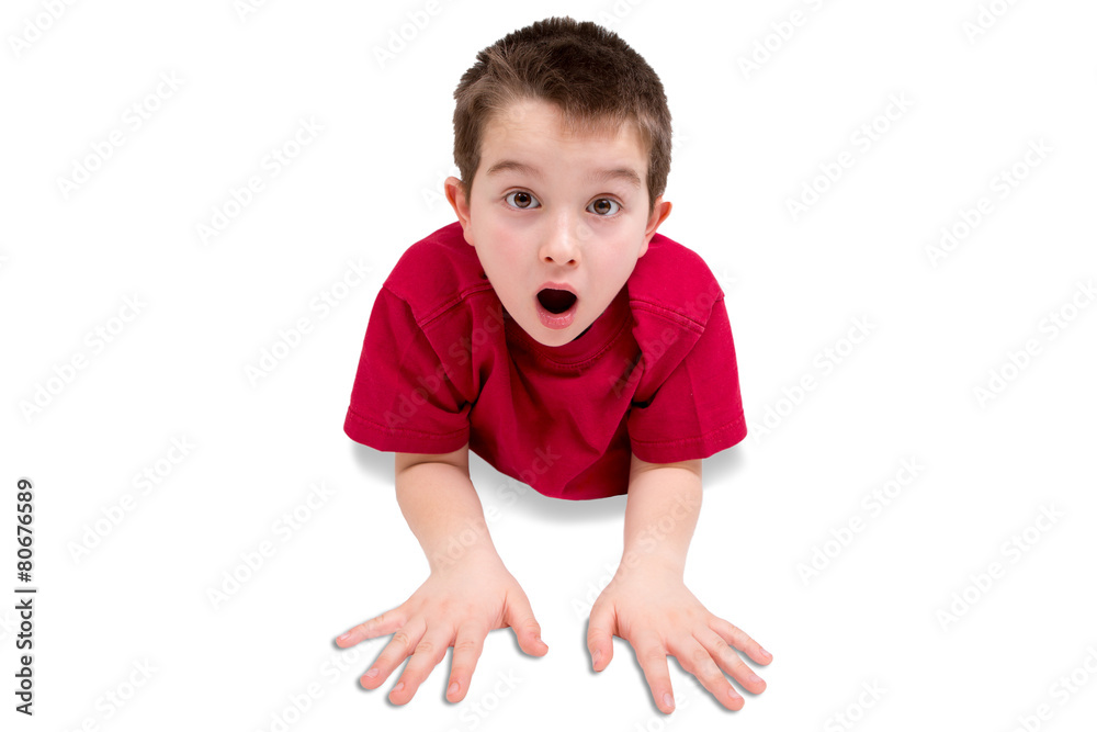 Surprised Cute Male Kid Lying on his Stomach Surprised Cute Male Kid Lying on his Stomach