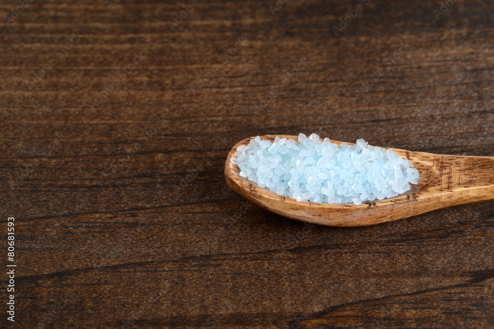 closeup bath salts in wood spoon closeup bath salts in wood spoon
