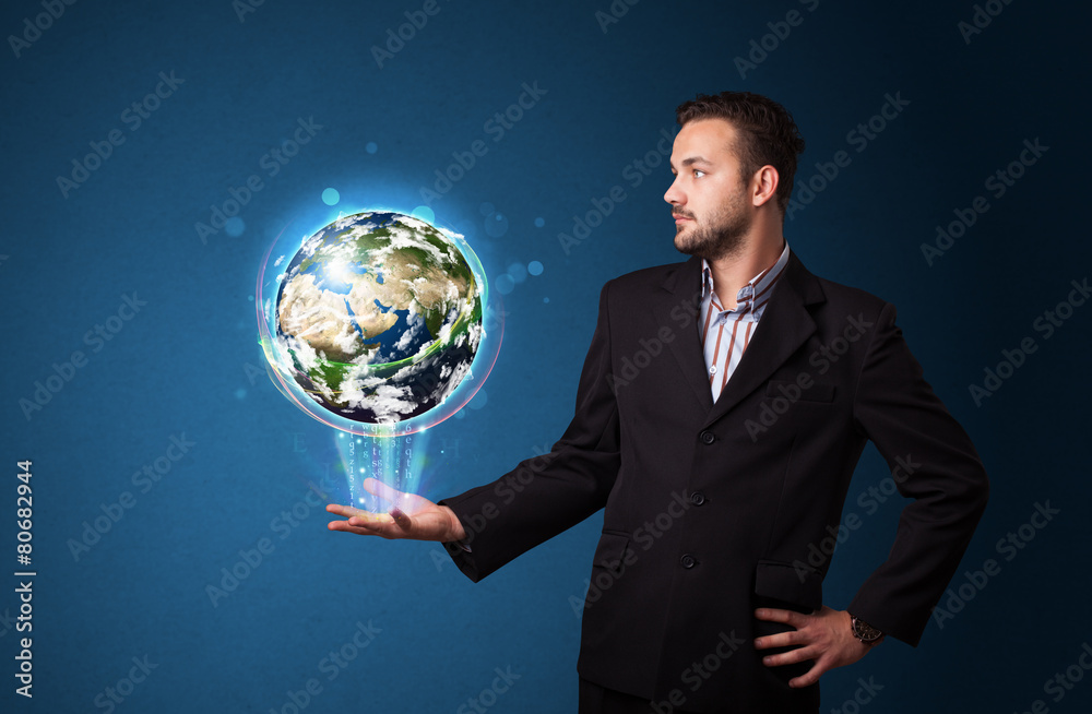 Businessman holding glowing earth globe Businessman holding glowing earth globe