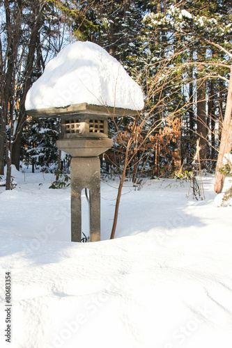 Snowy Japanese Stone Lantern in the garden, Hokkaido, Japan photo