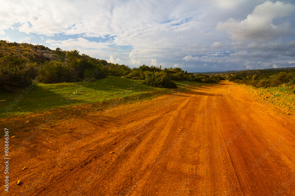 Fototapeta premium red clay rural road