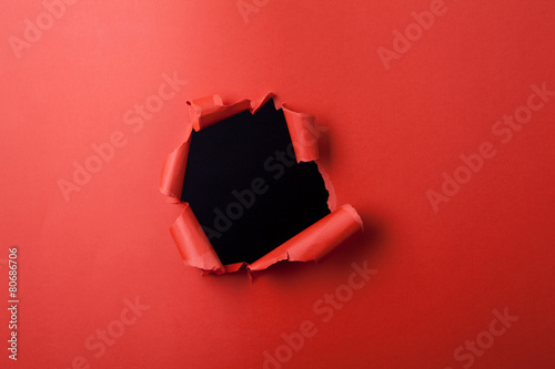 Red paper with hole.