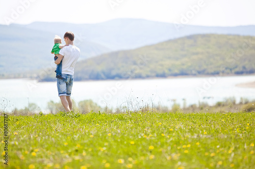 Father with son are playing in nature 