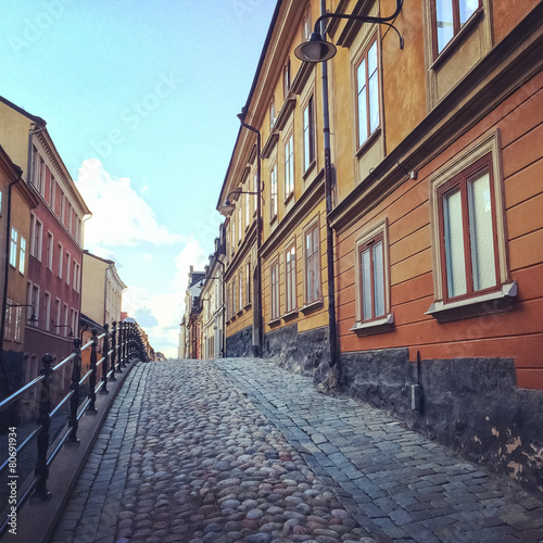 Cobblestone street with old buildings in Stockholm