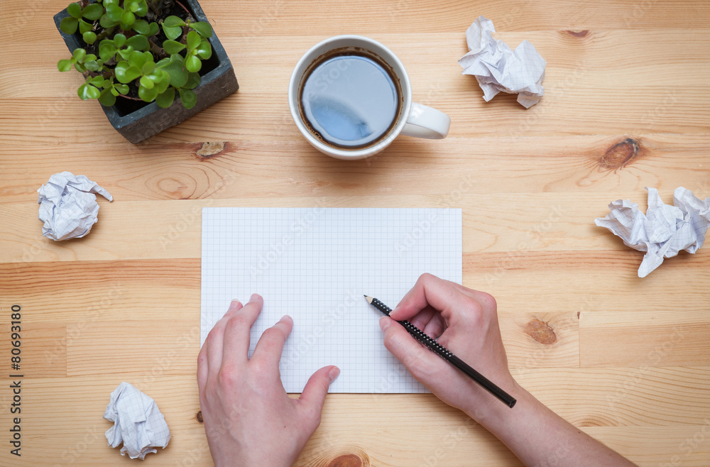 Blank notepad with pencil and coffee on wooden desk Blank notepad with pencil and coffee on wooden desk