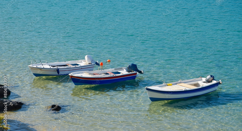 Three  moored boats at the sea shore