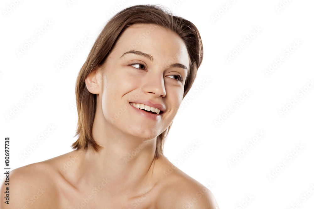 Happy young beautiful girl without make up on white background