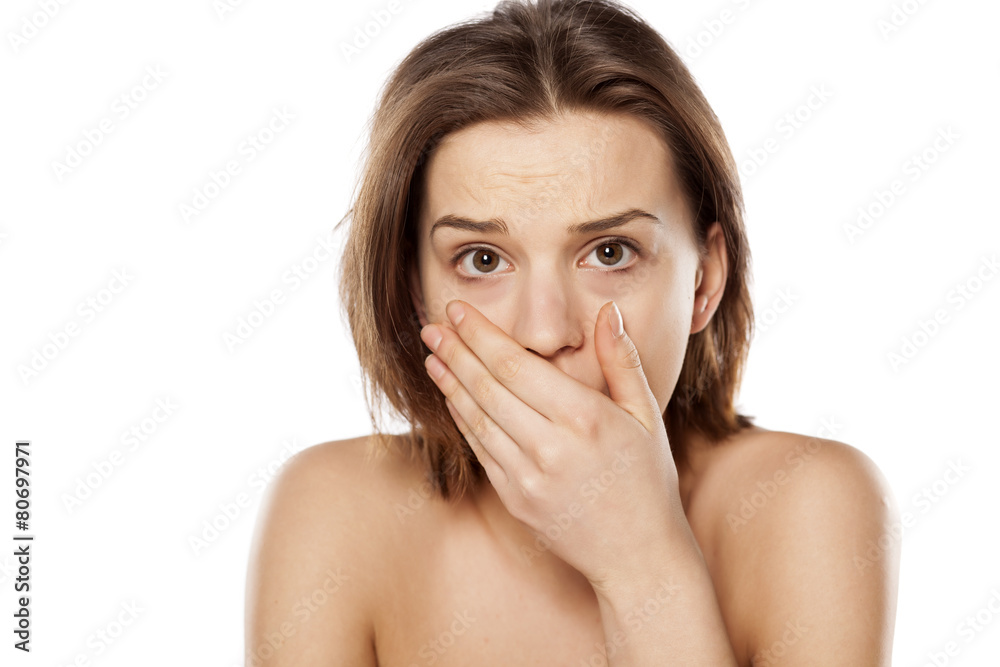 shocked and frightened girl on a white background shocked and frightened girl on a white background