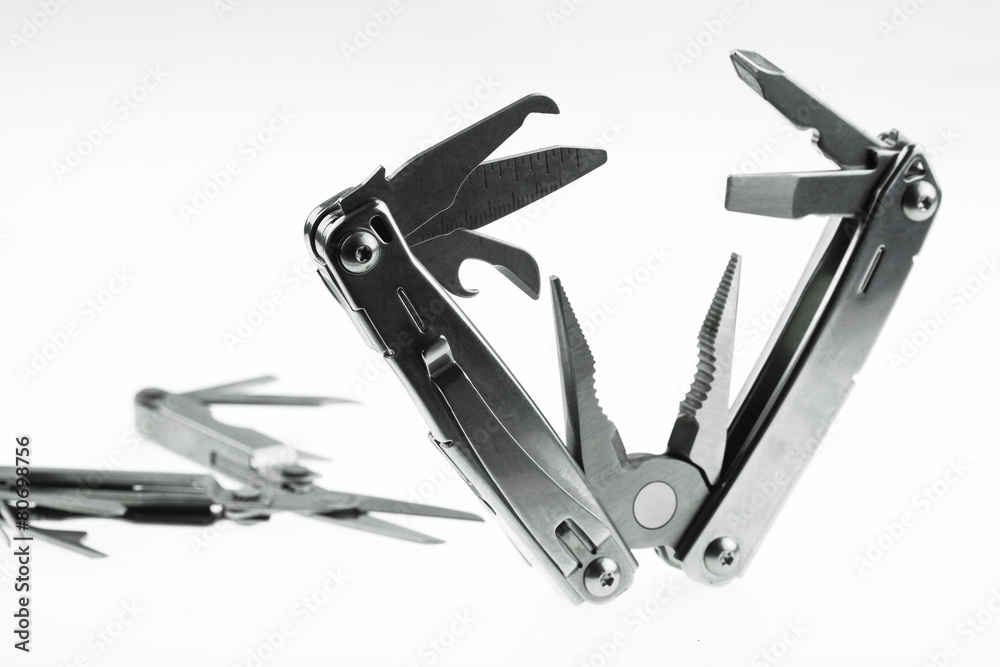 Pocket knife or Steel multi-function tools isolated on white Pocket knife or Steel multi-function tools isolated on white