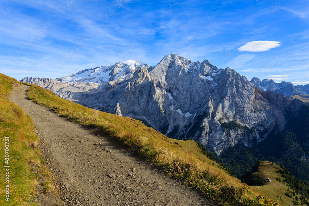 Hiking path and view of Marmolada in Dolomites Mountains, Italy