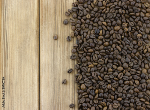 Coffee beans on wooden background