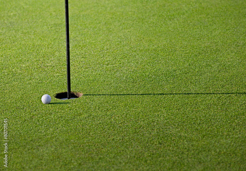Golfball close to hole