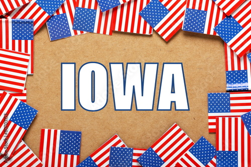 The title IOWA with a border of USA flags