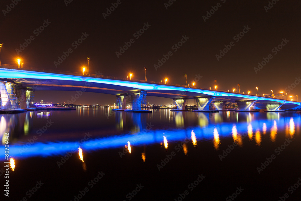 Fototapeta premium Blue illuminated Al Garhoud Bridge in Dubai, UAE