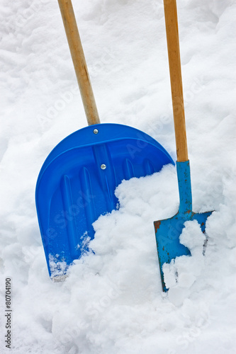 Two Shovels In The Snow Heap