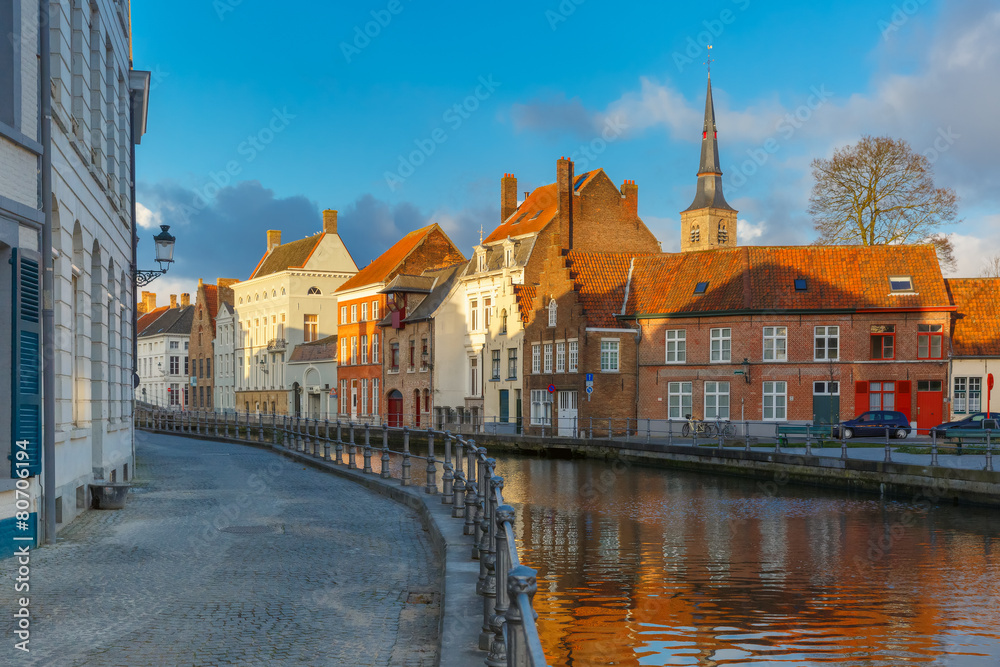 Scenic Bruges canal with beautiful houses and church