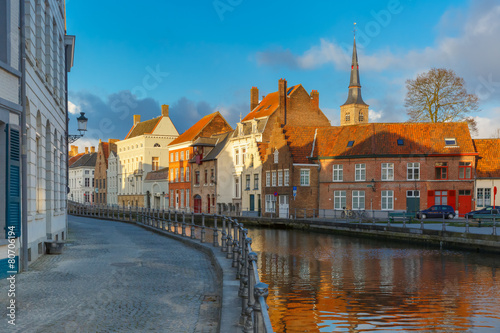 Scenic Bruges canal with beautiful houses and church