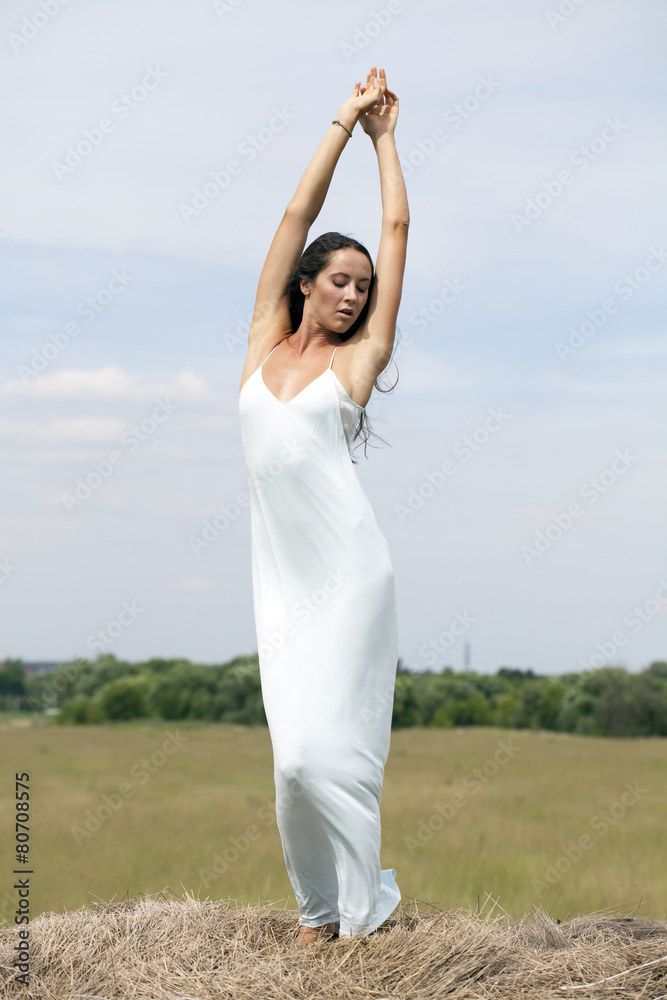 Young beautiful woman in the hayloft in the village Young beautiful woman in the hayloft in the village