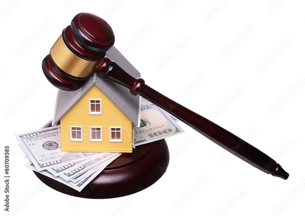 Concept of house sale with gavel and money isolated Concept of house sale with gavel and money isolated