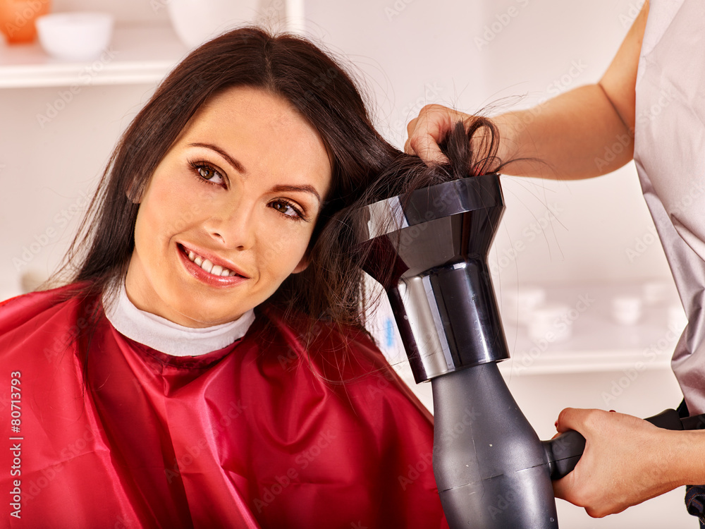 Woman at hairdresser.