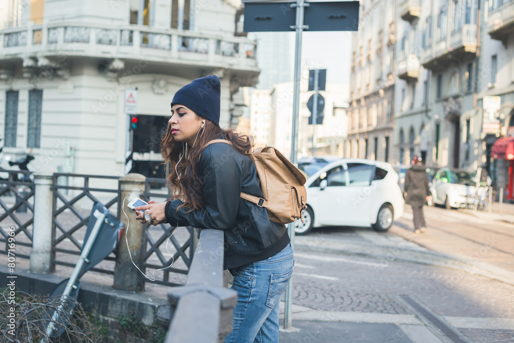 Fototapeta premium Beautiful girl posing in an urban context