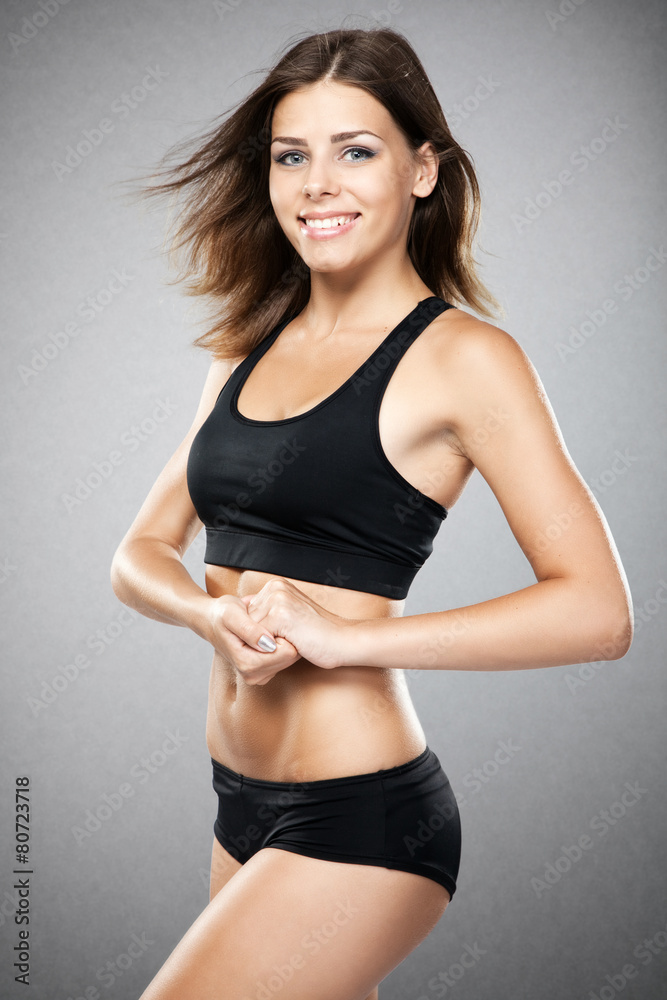 Young fit woman in sports outfit Young fit woman in sports outfit